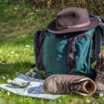 backpack with a hat and a pair of leather shoes