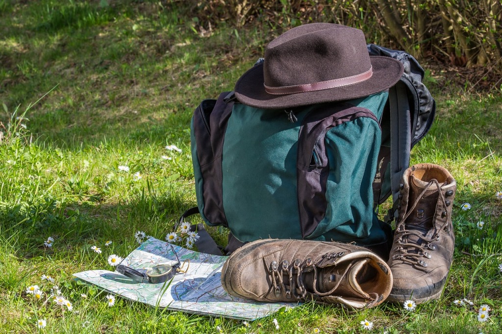 backpack with a hat and a pair of leather shoes