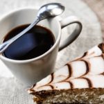 a cup of coffee and a slice of cake